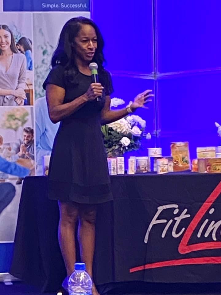 Jana Rose Stewart speaking on stage